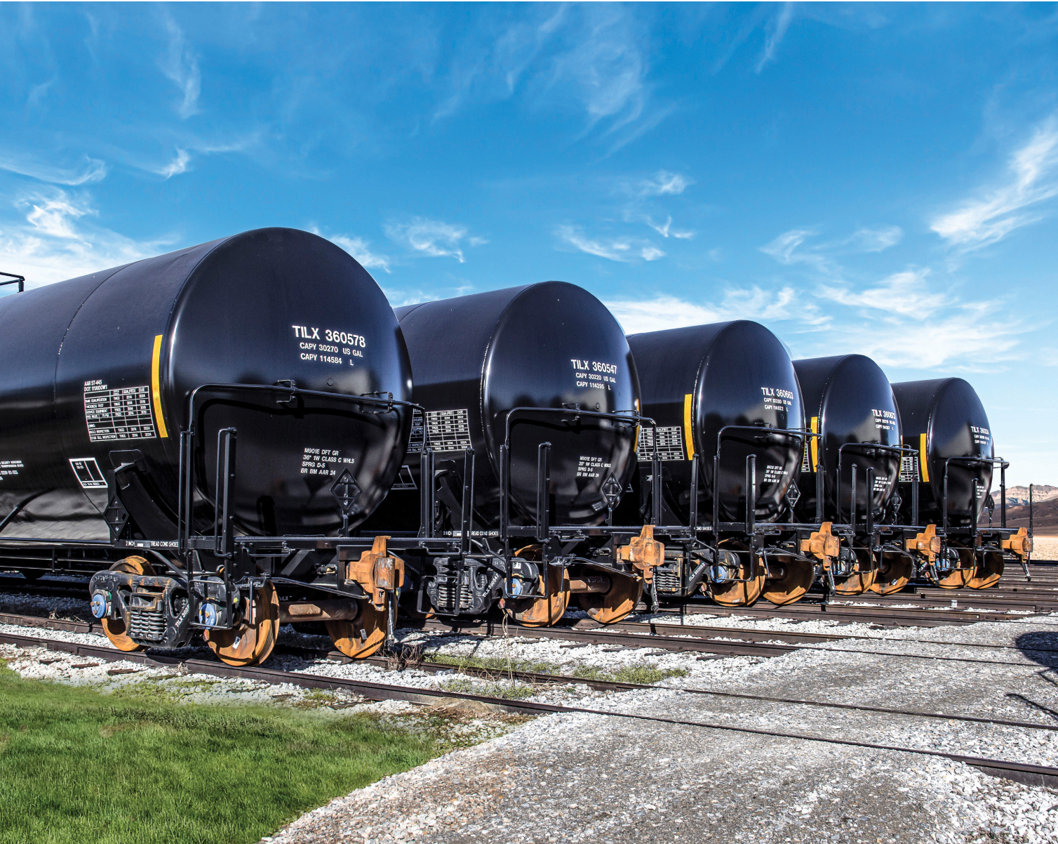 A line of black tank cars