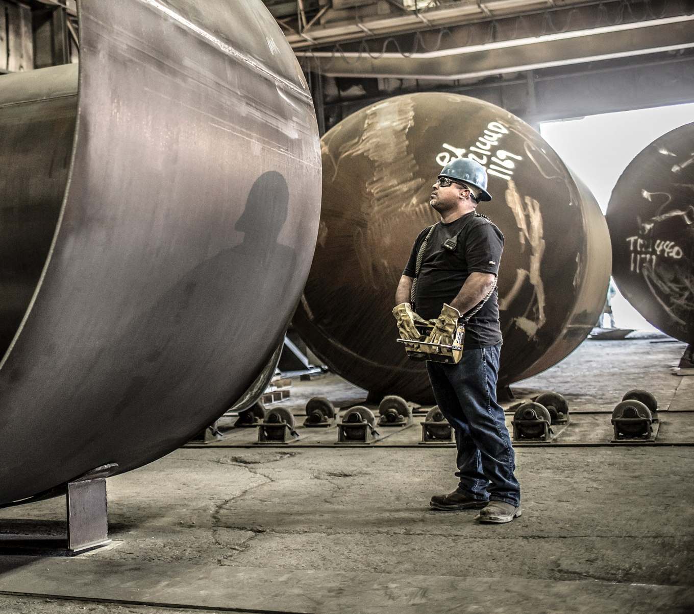 A railroad worker stands alongside rail equipment