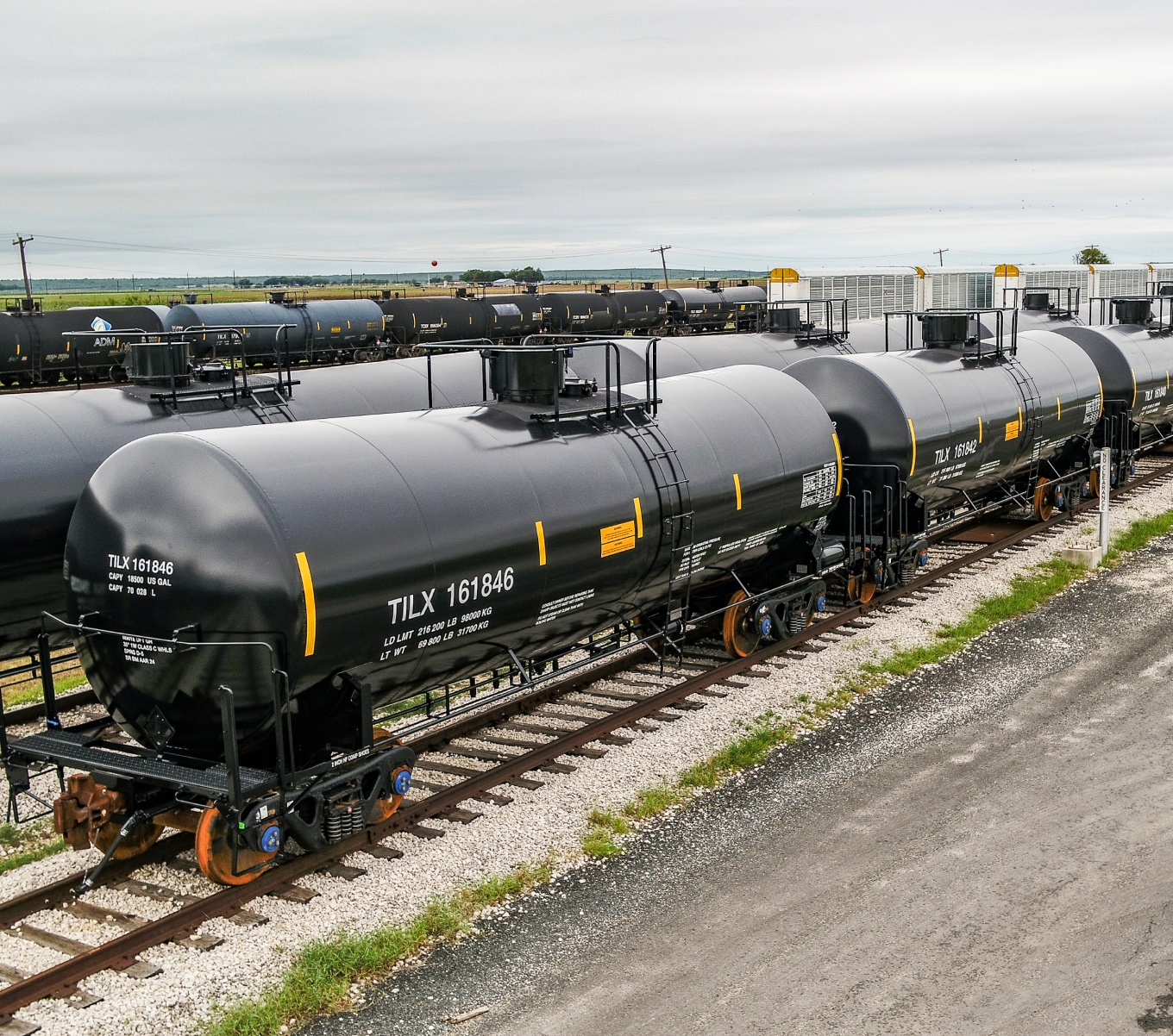 A line of black tank cars